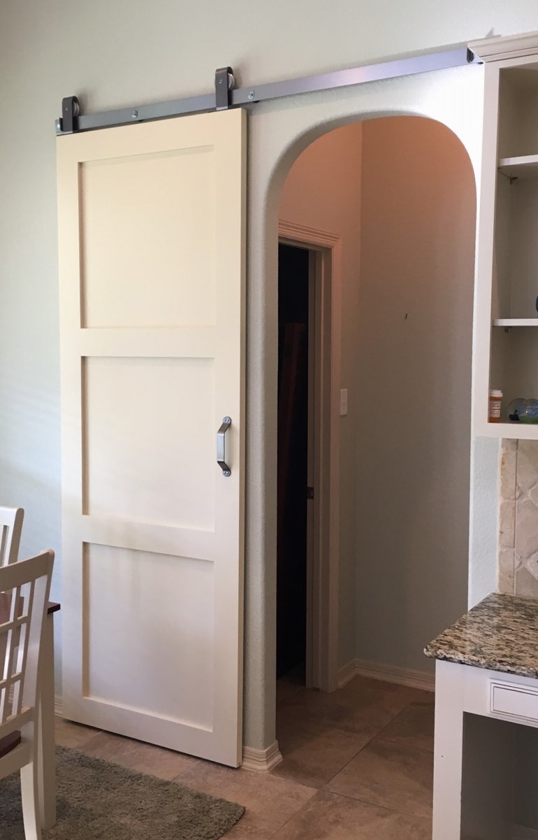 Contemporary style barn door in Austin kitchen.